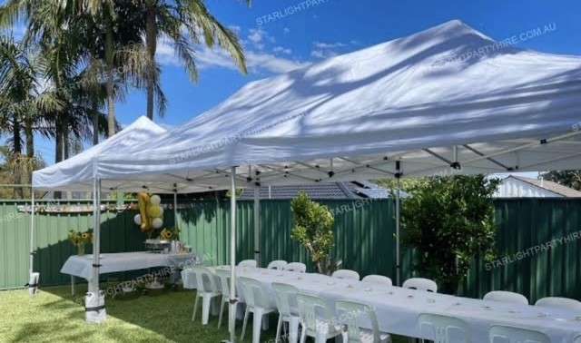 Gazebo, tables and chairs set up for a backyard party in Brisbane