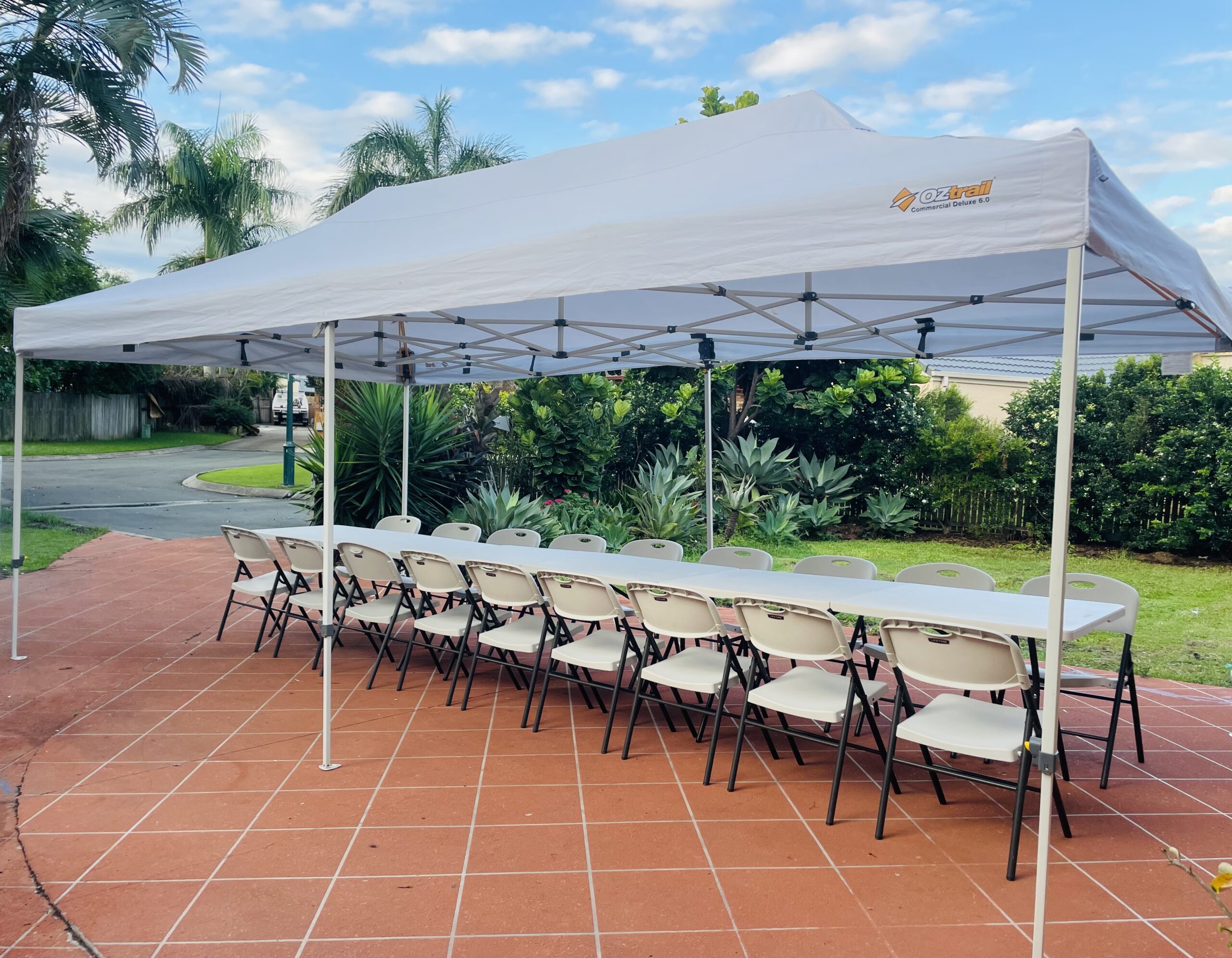 Gazebo, tables and chairs hire set up for a party in Brisbane